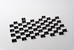 50 black acrylic triangular blocks with white numbers in front of a white background