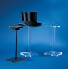 An assortment of helmet/hat stands, one of which is displaying a top hat