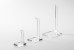 Tall clear acrylic stand in front of white background