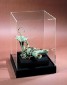 Climate-protected display with ancient copper oil lamp contained within